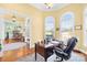 Bright home office featuring arched windows, natural light, and classic wooden furniture at 458 Inverness Pl, Rock Hill, SC 29730