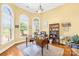 Inviting home office featuring arched windows, a bookshelf, and hardwood flooring at 458 Inverness Pl, Rock Hill, SC 29730