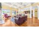 Spacious living room opens to the kitchen area, features coffered ceilings and hardwood floors at 458 Inverness Pl, Rock Hill, SC 29730