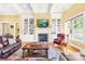 Inviting living room showcases fireplace with built-in shelving and an area rug on hardwood floors at 458 Inverness Pl, Rock Hill, SC 29730