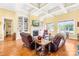 Bright living room features a fireplace, built-in shelves, coffered ceiling and hardwood floors at 458 Inverness Pl, Rock Hill, SC 29730