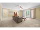 Spacious living room with a ceiling fan, carpet, and lots of natural light from the french doors at 458 Inverness Pl, Rock Hill, SC 29730