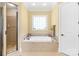 Relaxing main bathroom features a shower and soaking tub with tile flooring at 458 Inverness Pl, Rock Hill, SC 29730