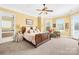 Spacious main bedroom with carpet flooring, bright windows and a ceiling fan at 458 Inverness Pl, Rock Hill, SC 29730