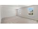 Spacious bedroom with natural light, carpet flooring and view to the outside at 4623 Harris Elliot Rd, Lincolnton, NC 28092