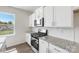 Modern kitchen with stainless steel appliances, white cabinets, granite counters and tile backsplash at 4623 Harris Elliot Rd, Lincolnton, NC 28092