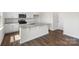 A kitchen featuring granite countertops, white cabinetry, stainless appliances, and modern fixtures at 4623 Harris Elliot Rd, Lincolnton, NC 28092