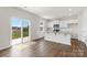 Bright kitchen boasts granite countertops, stainless appliances, and a sliding door to the backyard at 4623 Harris Elliot Rd, Lincolnton, NC 28092