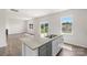 Modern kitchen with stainless steel appliances, granite counters, and an island sink overlooking the living room at 4623 Harris Elliot Rd, Lincolnton, NC 28092