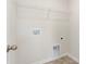 Laundry room with hookups and overhead wire shelving at 4623 Harris Elliot Rd, Lincolnton, NC 28092