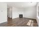Light-filled living room with a cozy fireplace and hardwood floors creating a warm, inviting space at 4623 Harris Elliot Rd, Lincolnton, NC 28092