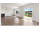 Bright and open living room featuring a fireplace, new hardwood floors, and sliding glass doors at 4623 Harris Elliot Rd, Lincolnton, NC 28092