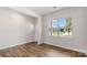 Bright, open living room with new hardwood floors and neutral paint and large window at 4623 Harris Elliot Rd, Lincolnton, NC 28092