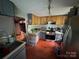Well-equipped kitchen featuring modern appliances, ample cabinet space, and a view to the adjacent room at 506 Sycamore Ave, Gastonia, NC 28052