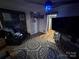 Modern living room featuring a large TV, stylish decor, and ambient lighting, perfect for relaxing and entertaining at 506 Sycamore Ave, Gastonia, NC 28052