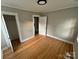 A bright bedroom with hardwood floors and neutral paint creates a cozy atmosphere at 520 Margaret Dr, Statesville, NC 28677
