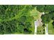 Expansive property featuring a home, lush greenery, defined boundaries, and a long driveway at 5305 Friendly Baptist Church Rd, Indian Trail, NC 28079