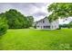 Backyard with new sod installed and mature trees at 5305 Friendly Baptist Church Rd, Indian Trail, NC 28079