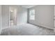 Bedroom with neutral paint, plush carpeting, and natural light at 5305 Friendly Baptist Church Rd, Indian Trail, NC 28079