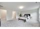 Large bedroom with soft carpet, a bench at the foot of the bed, and two windows at 5305 Friendly Baptist Church Rd, Indian Trail, NC 28079