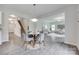 Open floor plan with a dining area, stairway, and living room with lots of light at 5305 Friendly Baptist Church Rd, Indian Trail, NC 28079