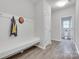 Entryway with a coat rack and a bench, and access to a half bath at 5305 Friendly Baptist Church Rd, Indian Trail, NC 28079