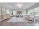 Spacious living room with a large rug and lots of natural light from the windows at 5305 Friendly Baptist Church Rd, Indian Trail, NC 28079