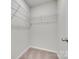 Walk-in closet with wire shelving and plush carpet at 5305 Friendly Baptist Church Rd, Indian Trail, NC 28079