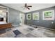 Bedroom featuring windows, gray walls, and a carpet tile pattern at 604 Meadowbrook Rd, Kings Mountain, NC 28086