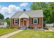Charming brick home with a red front door and green lawn at 604 Meadowbrook Rd, Kings Mountain, NC 28086