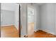 Hallway displaying hardwood floors and open doorways to other rooms at 604 Meadowbrook Rd, Kings Mountain, NC 28086
