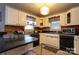 Quaint kitchen featuring white cabinets and modern appliances at 604 Meadowbrook Rd, Kings Mountain, NC 28086