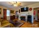 Cozy living room with hardwood floors, fireplace, and comfortable seating at 604 Meadowbrook Rd, Kings Mountain, NC 28086