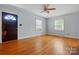 Unfurnished living room featuring hardwood floors, two windows, and a door at 604 Meadowbrook Rd, Kings Mountain, NC 28086