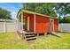 Cozy backyard shed featuring a covered porch, offering extra storage and outdoor relaxation at 604 Meadowbrook Rd, Kings Mountain, NC 28086