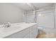 Bathroom featuring double vanity, shower, and tile flooring at 6434 Skyline Dr, Charlotte, NC 28269
