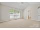 Bedroom with vaulted ceiling, neutral carpet and en-suite bathroom at 6434 Skyline Dr, Charlotte, NC 28269