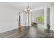 Open dining space with elegant chandelier and hardwood floors at 6434 Skyline Dr, Charlotte, NC 28269