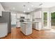 Bright kitchen featuring a center island, stainless steel appliances, and ample storage at 6434 Skyline Dr, Charlotte, NC 28269