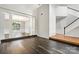 Open-concept living space boasting hardwood floors, white wainscoting, and abundant natural light at 6434 Skyline Dr, Charlotte, NC 28269