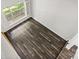Upstairs hallway with hardwood floors and a view to the outside at 6434 Skyline Dr, Charlotte, NC 28269