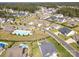 A bird's eye view of the house in its neighborhood, showing community pool and playground at 7112 Irongate Dr, Indian Land, SC 29707