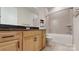 Bathroom featuring wood cabinets, granite counters, framed mirror and a shower-tub combination at 7112 Irongate Dr, Indian Land, SC 29707