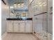 An ensuite bathroom boasting a glass shower, an abundance of cabinetry, and neutral colors at 7112 Irongate Dr, Indian Land, SC 29707