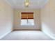 Neutral bedroom with carpeted floors, large window, and modern lighting at 7112 Irongate Dr, Indian Land, SC 29707
