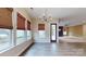 The sunny dining area features large windows and transitions seamlessly into the living room at 7112 Irongate Dr, Indian Land, SC 29707