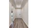 Inviting hallway with wood flooring leading to the front door with recessed lighting at 7112 Irongate Dr, Indian Land, SC 29707