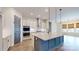 Bright kitchen with a large center island, stainless appliances, and modern pendant lighting at 7112 Irongate Dr, Indian Land, SC 29707