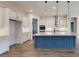 Modern kitchen featuring a large island, stainless steel appliances, and custom cabinets at 7112 Irongate Dr, Indian Land, SC 29707