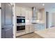 Stainless double ovens and white subway tile backsplash in kitchen at 7112 Irongate Dr, Indian Land, SC 29707